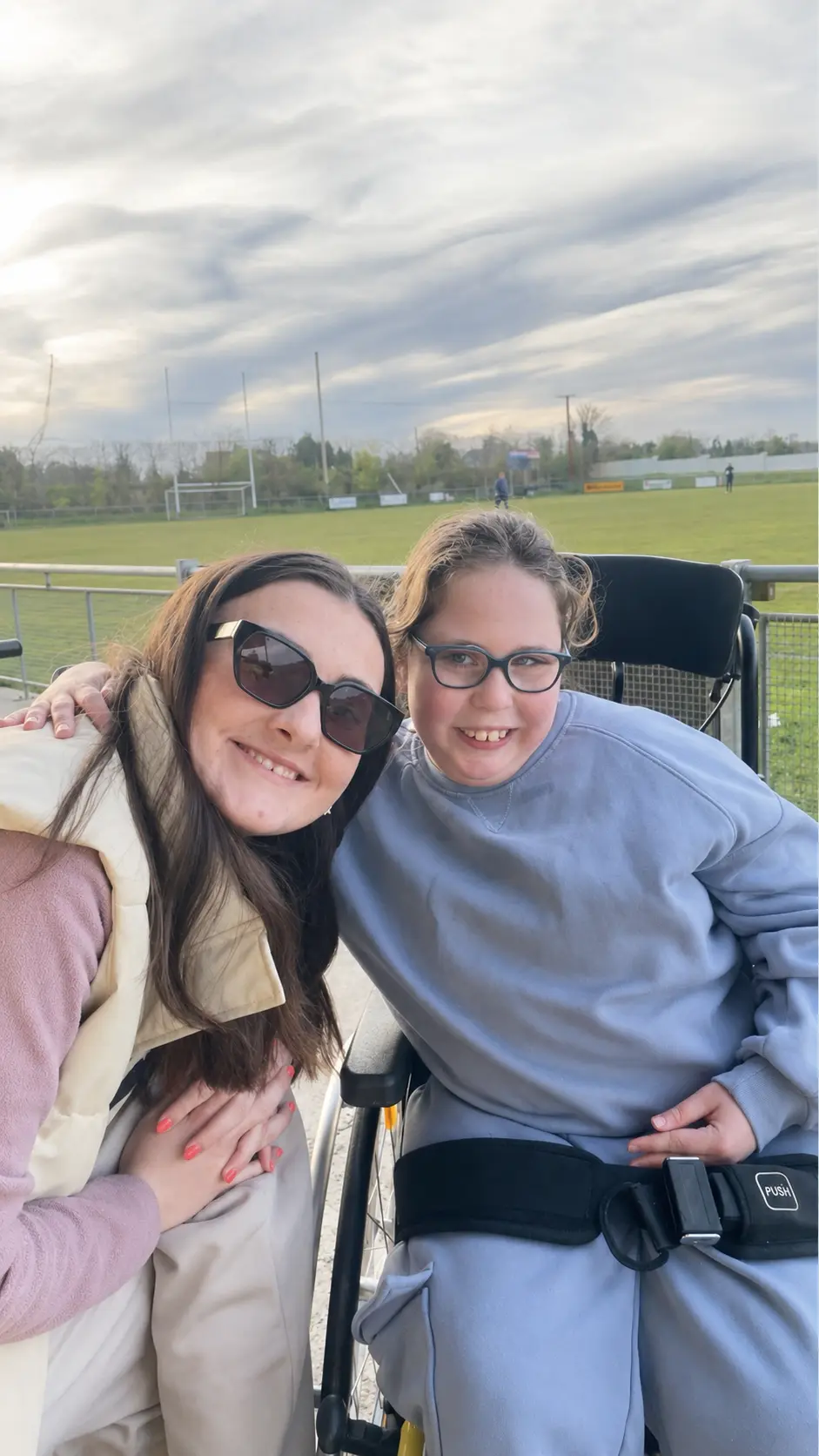 Support worker and client at a community sports ground