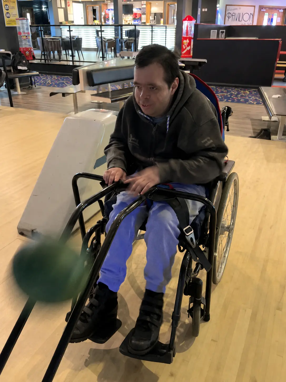 Heading down the lane in a wheelchair