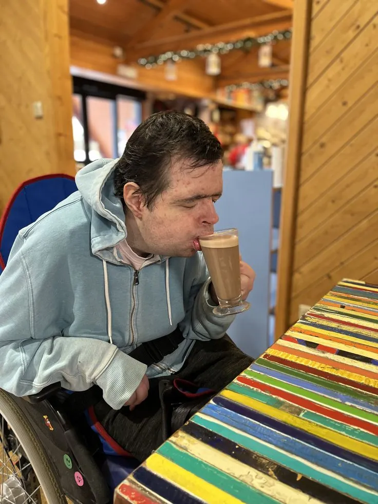 Client enjoying a coffee at a local café